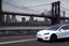 Placeholder: A Tesla 'Model 3' is drifting at top speed, on the 'Brooklyn Bridge' in New York. CINEMATIC. WIDE ANGLE LENS. PHOTO REAL.