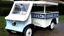 Placeholder: antique electric milk float vehicle