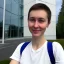 Placeholder: A short haired, female software engineer taking a selfie in front of Building 92 at Microsoft in Redmond, Washington