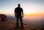 Placeholder: a brawny man with grey hair views sunset from a cliff