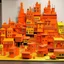 Placeholder: An orange colored town made out of toys painted by Piet Mondrian