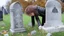 Placeholder: person spitting on a grave stone