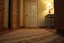 Placeholder: generate a closeup of a motel room floor, showing an imprint of a missing rug