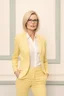 Placeholder: Powerful classical portrait of a modern blonde politician with glasses in her mid 40s wearing a pastel yellow pant suit standing in a elegant position.
