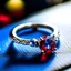 Placeholder: solitaire engagement ring with blue center stone and red stones of the sides