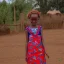 Placeholder: Girl with amazing Ethiopian traditional clothes in farming area playing