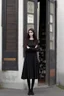 Placeholder: tall thin girl in black clothes, long dark wavy hair, outside an apothecary shop