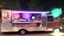 Placeholder: modern looking food truck that has a bunch of flashy lights and fireworks