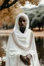 Placeholder: All white textured an arabica woman wearing a white African cloths white trees in the background also a white lake