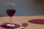 Placeholder: cup of red wine on a table