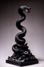 Placeholder: an ominous small statuette made of ebony in the form of a mountain with the snake slithering around the mountain