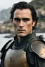 Placeholder: A portrait of Joaquin Phoenix in his early 30s, beachy haircut, black hair, on a rocky island, in burnished medieval samurai armor, melancholic and dangerous facial expression, half-smiling