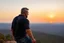 Placeholder: a brawny man with grey hair views sunset from a cliff