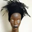 Placeholder: black raffia head piece