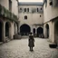 Placeholder: A documentary-style historical photograph with a gritty, filmic 1970s texture. The scene is the inner courtyard of the Royal Court in Chinon during medieval times. A wide-angle shot, taken from a slightly low perspective, captures Joan of Arc, 17, at the moment she is flanked by Jean de Metz and Bertrand de Poulengy. They are dressed in dusty, tarnished plate armor and leather. Joan herself wears simple, stained tunic and breeches, her hair shorn short, looking directly up toward the massive sto