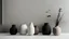 Placeholder: minimalist scandinavian interior. pots, black, beige, white