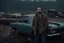 Placeholder: a handsome young beard Shia LaBeouf detective in knitted fashion armed with gun hides behind a broken car and looks around in a junkyard full of broken cars, a rainy and foggy day, Stanley Kubrick movie style