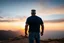 Placeholder: a brawny man with grey hair views sunset from a cliff