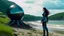 Placeholder: A long-haired woman in a robotic-looking catsuit standing on a beach of a rocky landscape with a crashed spaceship in the distance, with a forest beyond