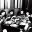 Placeholder: Creepy old photo of minecraft people sitting at dinner with weird children