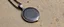 Placeholder: painite and Damascus steel pendant
