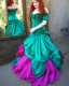 Placeholder: Magic princess with long auburn hair in a big teal green and gold satin ballgown corset off shoulder top casting magic