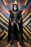 Placeholder: text 'KISS' - head and shoulders portrait, KISS 20-year-old Gene Simmons, black spandex, chrome shoulder and chest armor, black batwing cape, studded codpiece, 8-inch platform boots, bun on top of head, - a multicolored cement wall in the background,