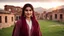 Placeholder: A photographic middle shot of a beautiful a young Pakistani pashto woman (age 25 with beautiful black hair and pretty eyes) in a beautiful traditional maroon & white checkered dress with white dupatta happily standing outside beautiful village houses made bricks with long grass and mountains behind her at beautiful cloudy sunset with sun-rays on her face showing cinematic And dramatic ambiance.