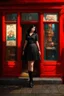 Placeholder: Photorealistic image of a young woman with dark hair, in a black ankle length skirt, boots and shirt, standing outside an old magic shop front with large red painted multi-paned picture windows on either side of a multi-paned doorway.