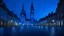 Placeholder: The image shows the market square in the city of Halle an der Saale as a deserted scene illuminated by pale blue light. In the center of the square is a 15th century bell tower with its neo-Gothic brick enclosure. On the left you can see the enormous Marienkirche with its four towers, in the style of Ernst Ludwig Kirchne