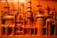 Placeholder: An orange colored mechanical factory with arrows designed in ancient Egyptian architectures and sculptures painted by Mark Rothko