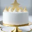 Placeholder: A picture of a simple white cake with golden decoration