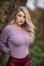 Placeholder: beautiful 18 year old girl with ash blonde hair and blue eyes with her curvy hair down, wearing a long-sleeved woollen top, and lilac long leggings, with long red boots full body shot