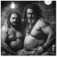 Placeholder: half figure shot photography of two angry gipsy 41 years old burly chubby ugly men embracing tightly, dreadlocks, shirtless, in a sauna full of steam, dim lights, side light, ambient occlusion,