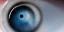 Placeholder: Medium shot of a human eye that contains a universe a