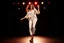 Placeholder: beautiful lady fullbody closeup shot in nice pants and shirt pretty boots dancing in stage