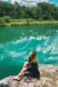 Placeholder: woman sitting on a rock, in a lake, green mottled skin, green hair, blue sky, white clouds