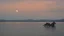 Placeholder: evening calm atmosphere, lake + moon, figure of a horse rider on the horizon