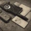 Placeholder: gamepad, compass, books on the white table