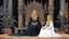 Placeholder: [colour illustration for Sorceress (1982)] Leigh Harris as the dark Lady of Whispers sits upon her ornate throne looking down at Lynette Harris the poor farmer blonde braids woman knelt before her, her eyes downcast in a mixture of fear and defiance.