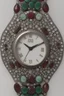 Placeholder: Silver wristwatch studded with precious stones containing the word jiks