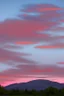 Placeholder: big rock mountains with and orange dawn sky with no clouds