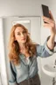 Placeholder: Generate a high-quality lifelike portrait of a {{18,21,25,28,31,34,37}}-year-old female social media inflluencer taking a cellphone selfie in the bathroom mirror. The POV should be from the perspective of the woman taking the selfie. She should have a slender body and be wearing skin-tight and very thig gym clothes. Her long black curly hair should be styled in a whimsical way. The photo should be captured using a 35mm film with a macro shot and shallow depth of field to create a bokeh effect. P