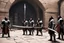 Placeholder: Four Klingon warriors gather in the stone courtyard of a fortress on Qo'noS, checking their traditional weapons before the battle. On the left, a warrior tests the weight of his massive bat'leth, while his comrades sharpen their d'k tahg daggers and mek'leth blades. Armor of leather, fur and spiked steel, braided hair, and banners of the Empire blowing in the cold mountain wind. No phasers. No mercy. Only Kahless' legacy. Inspired by Star Trek TNG / DS9 Klingon culture.