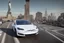 Placeholder: A Tesla 'Model S' is drifting at top speed, near the 'Statue of Liberty' in New York. CINEMATIC. WIDE ANGLE LENS. PHOTO REAL.
