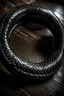 Placeholder: ouroboros made of black ink, leather background covering the whole image