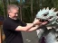 Placeholder: A man petting the cute dragon, linearr