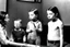 Placeholder: a photo of child-like Simone de Beauvoir and child-like Jean-Paul Sartre meeting child-like Che Guevara who is lighting a cigar for child-like Jean-Paul Sartre