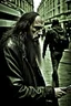 Placeholder: A stalker wants an autograph from a long-haired rock musician on a street in central London. The stalker is an overweight soon bald 25-year-old and looks a bit slimy, the atmosphere is oppressive and unpleasant, lot of traffic and london busses, hectic hour, a nice hotel, fog and rain