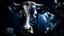 Placeholder: A serene, almost ethereal image of a bull's face, painted in deep indigo, adorned with delicate white jasmine blossoms, captured in soft focus under the diffused light of a studio setting.